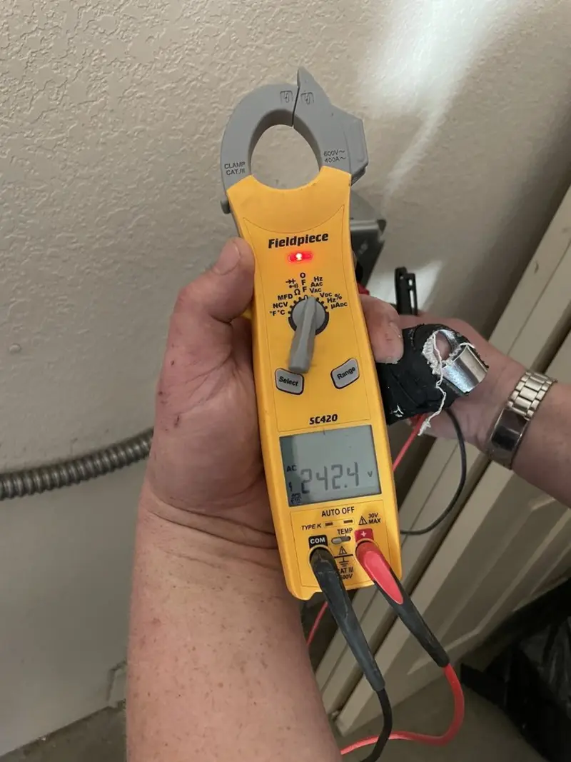 Voltage testing with clamp meter during Ceiling Fan Installation in Birmingham